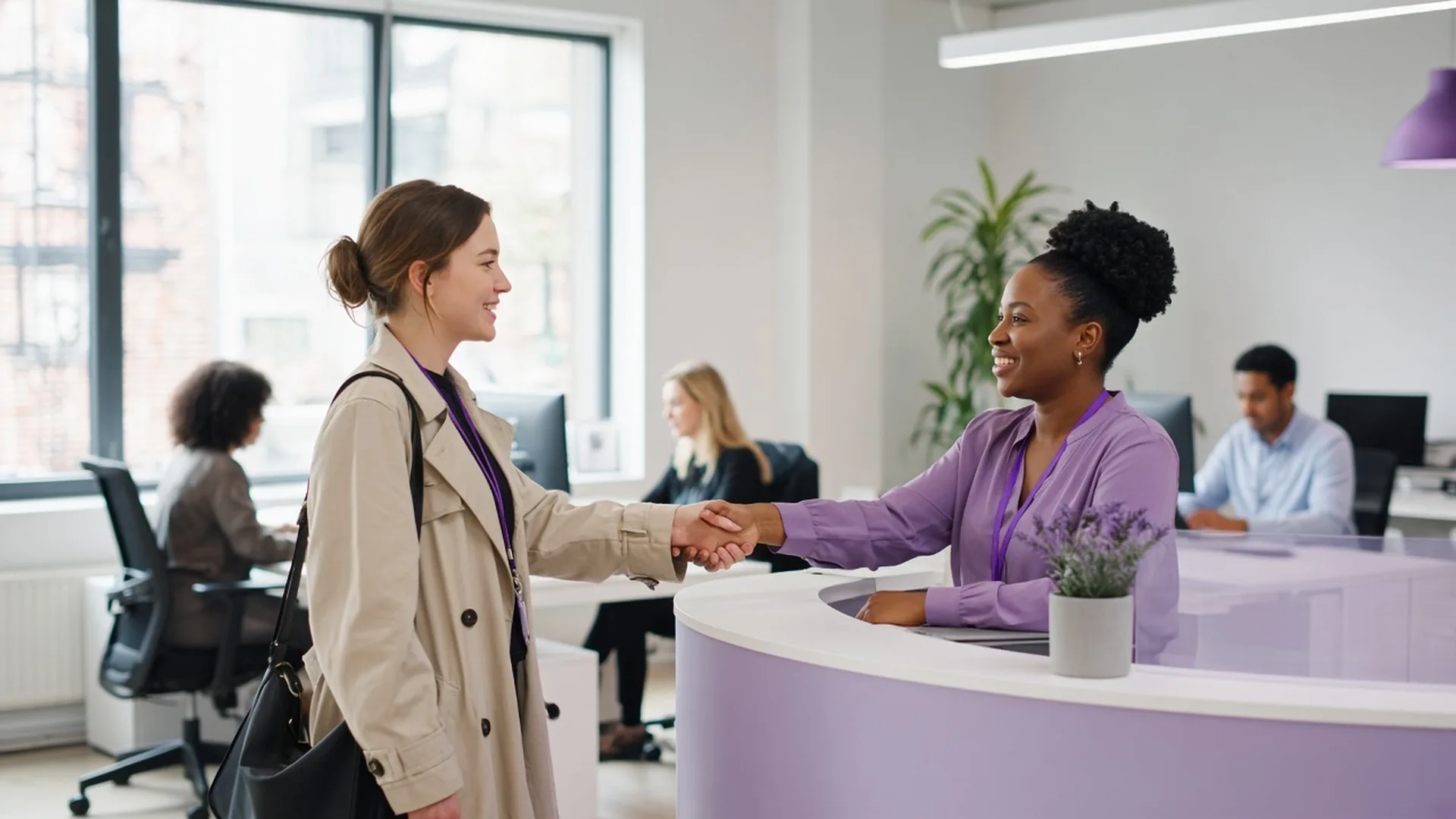 Temporary worker being welcomed at an office reception desk